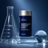 A dark blue supplement bottle labeled 'goodhealth VASCULAR CARDIO CARE' stands on clear acrylic blocks, with a glass beaker on the left and a glass sphere on the right, against a blue studio background.